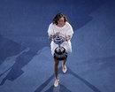 Martina Hingis carries the trophy