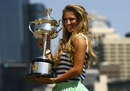 Victoria Azarenka poses with the Australian Open trophy on the banks of the Yarra