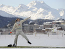 A woman prepares to bowl during 'Cricket on Ice' in Saint Moritz
