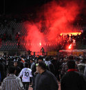 Fans light flares as violence erupts in Egypt