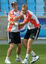 Andrew Strauss and Stuart Broad share a joke in training