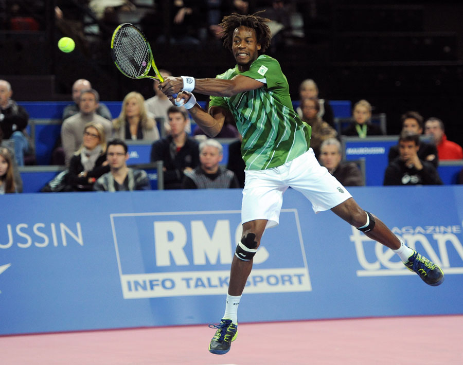 Gael Monfils leaps into a backhand