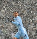 Sergio Aguero dashes through the snow