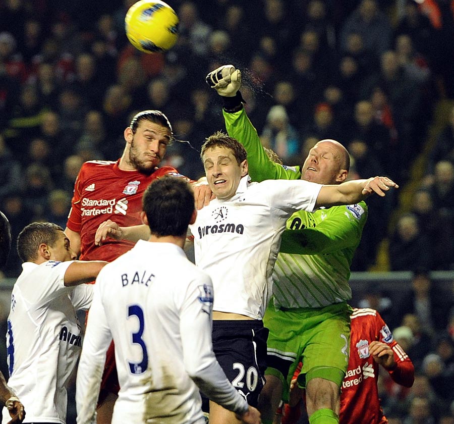 Brad Friedel punches clear from Andy Carroll