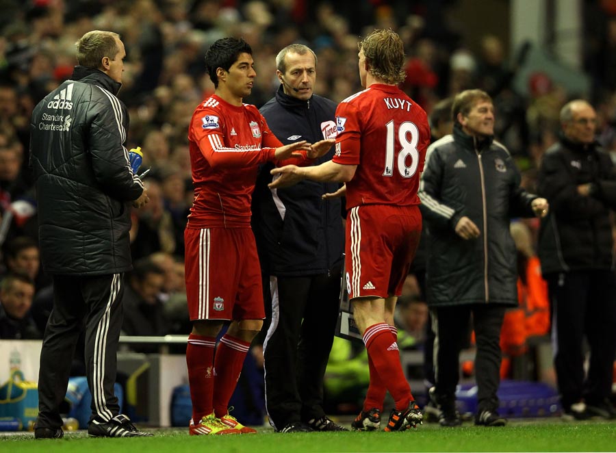 Luis Suarez comes on as a substitute for Dirk Kuyt