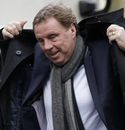 Harry Redknapp puts his coat on after getting out of a vehicle