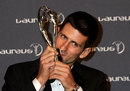 Novak Djokovic kisses his trophy
