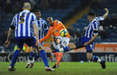 Ludovic Sylvestre curls the ball in for Blackpool's third