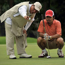 Boxer Manny Pacquiao lines up a putt