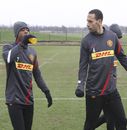 Patrice Evra and Rio Ferdinand arrive for training