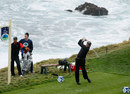 Phil Mickelson tees off as Tiger Woods watches on