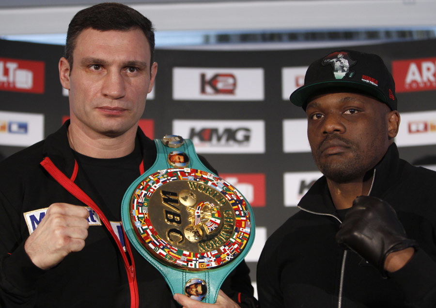 Vitali Klitschko and Dereck Chisora pose for the cameras at a press conference