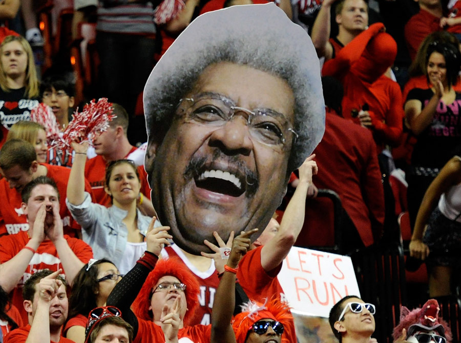 Fans hold up a cutout of boxing promoter Don King