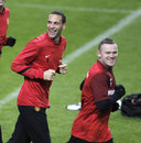 Wayne Rooney leads Rio Ferdinand in training