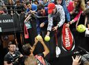 Roger Federer signs autographs for supporters 