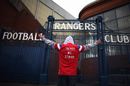 A Rangers fan makes his point outside Ibrox