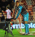 Alex Oxlade-Chamberlain gets caught up in the net