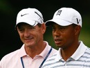 Tiger Woods chats with his swing coach Hank Haney