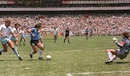 Diego Maradona runs past English defender Terry Butcher