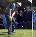 Phil Mickelson chips to the first green in the final round 