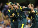 Ricky Ponting and Brett Lee celebrate after Peter Forrest takes a catch