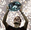 Roger Federer lifts the trophy