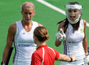 Kate Woods and Marsha Marescia of South Africa argue with the umpire