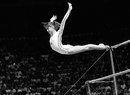 Nadia Comaneci dismounts from the uneven bars