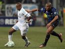 Andre Ayew holds off Inter defender Maicon