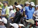 Tiger Woods reacts to his tee shot on the seventh hole