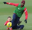 Andrei Arshavin tackles Alex Song during a training session