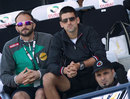 Novak Djokovic watches the action