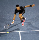 Novak Djokovic stretches for a drop shot
