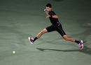 Novak Djokovic reaches for the ball