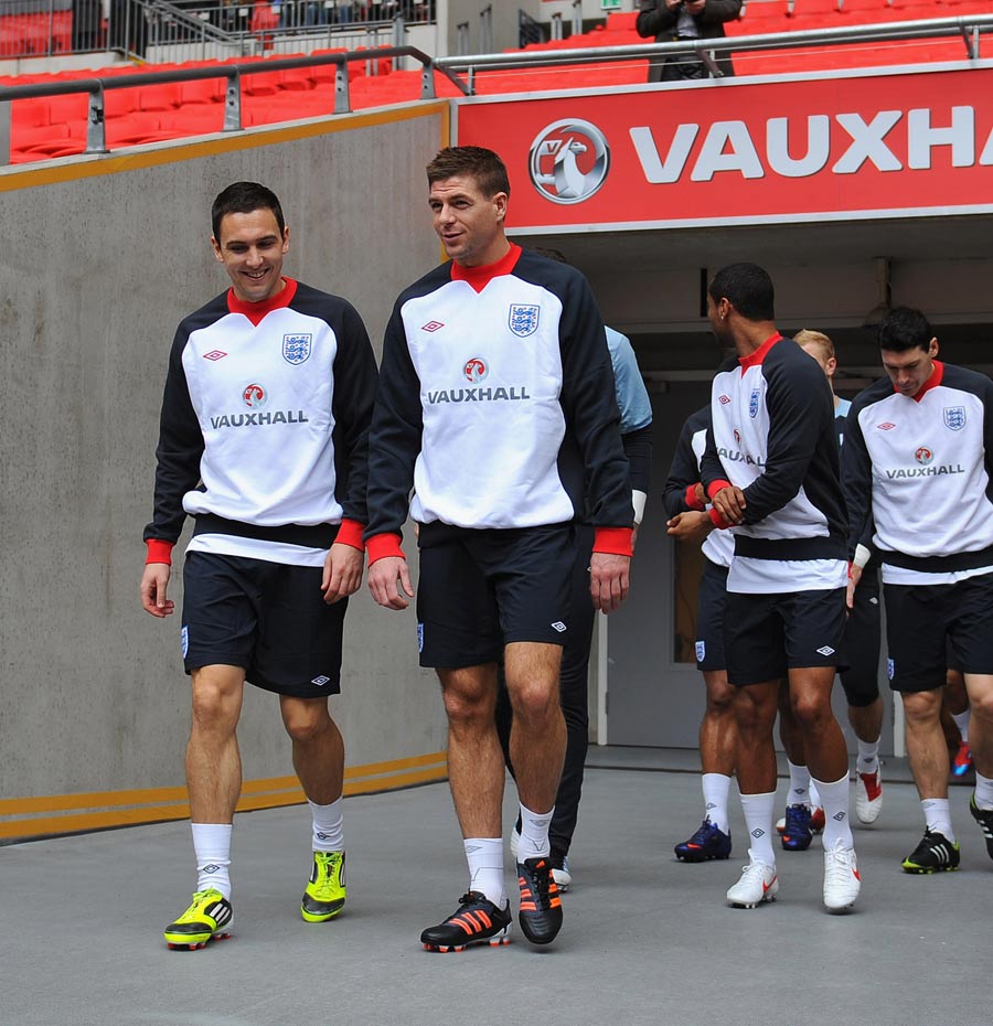 Stewart Downing and Steven Gerrard lead out the squad