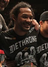 Benson Henderson poses for a photo with his team