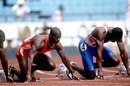 Ben Johnson sits in the blocks ahead of the men's 100m final