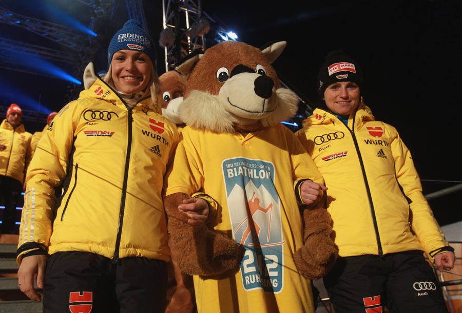 Members of the German team pose with the mascot at the Biathlon World Championships opening ceremony