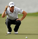Rory McIlroy lines up a putt