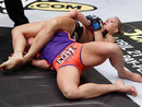 Ronda Rousey attempts to submit Miesha Tate