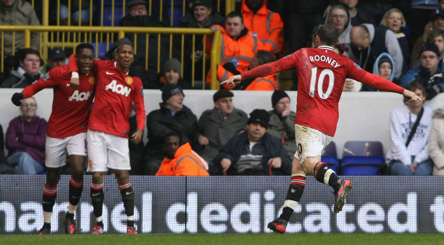 Wayne Rooney runs to celebrate with Ashley Young and Danny Welbeck