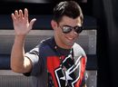 Dominick Cruz waves to the crowd before the NASCAR Sprint Cup Series SUBWAY Fresh Fit 500