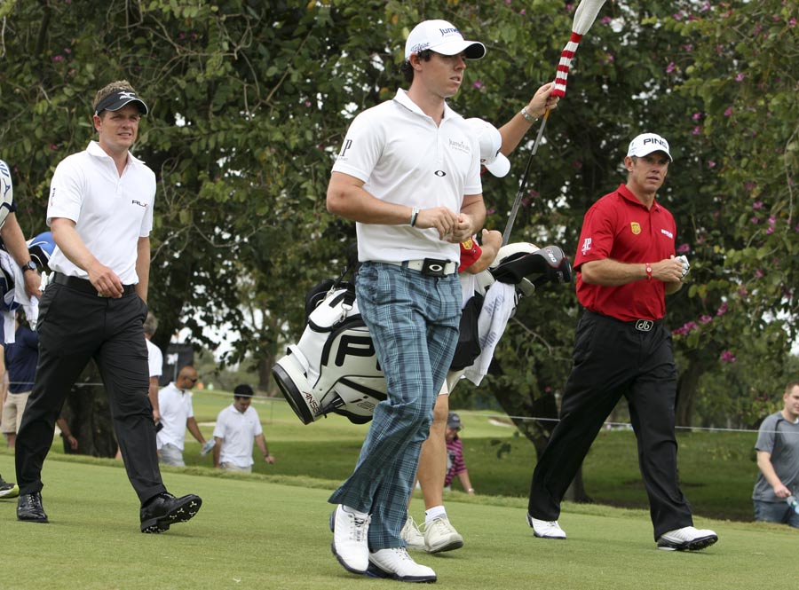 Luke Donald, Rory McIlroy and Lee Westwood walk from the 11th tee