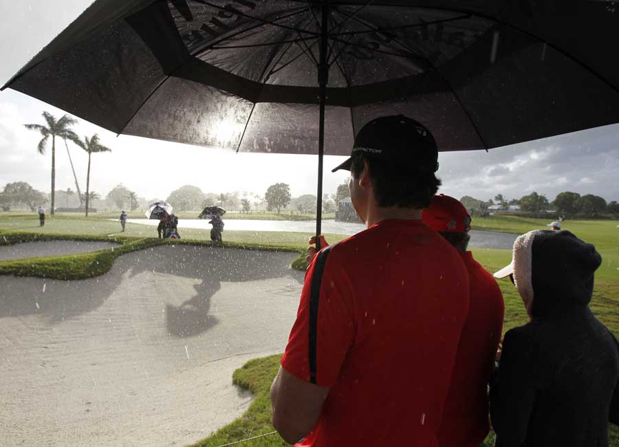 Fans watch play on the eighth hole