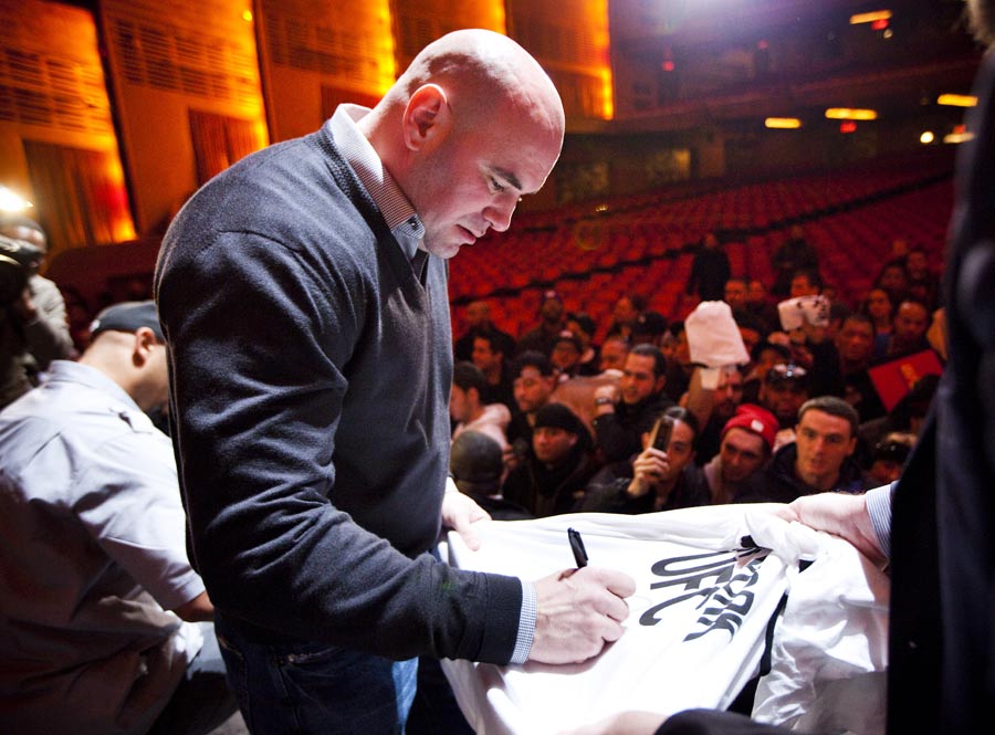 Dana White signs autographs for fans
