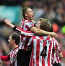 Sunderland players celebrate Nicklas Bendtner's goal