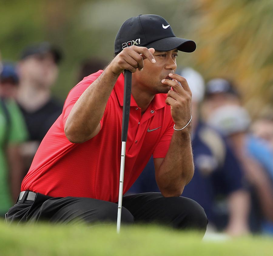 Tiger Woods waits on the fourth green