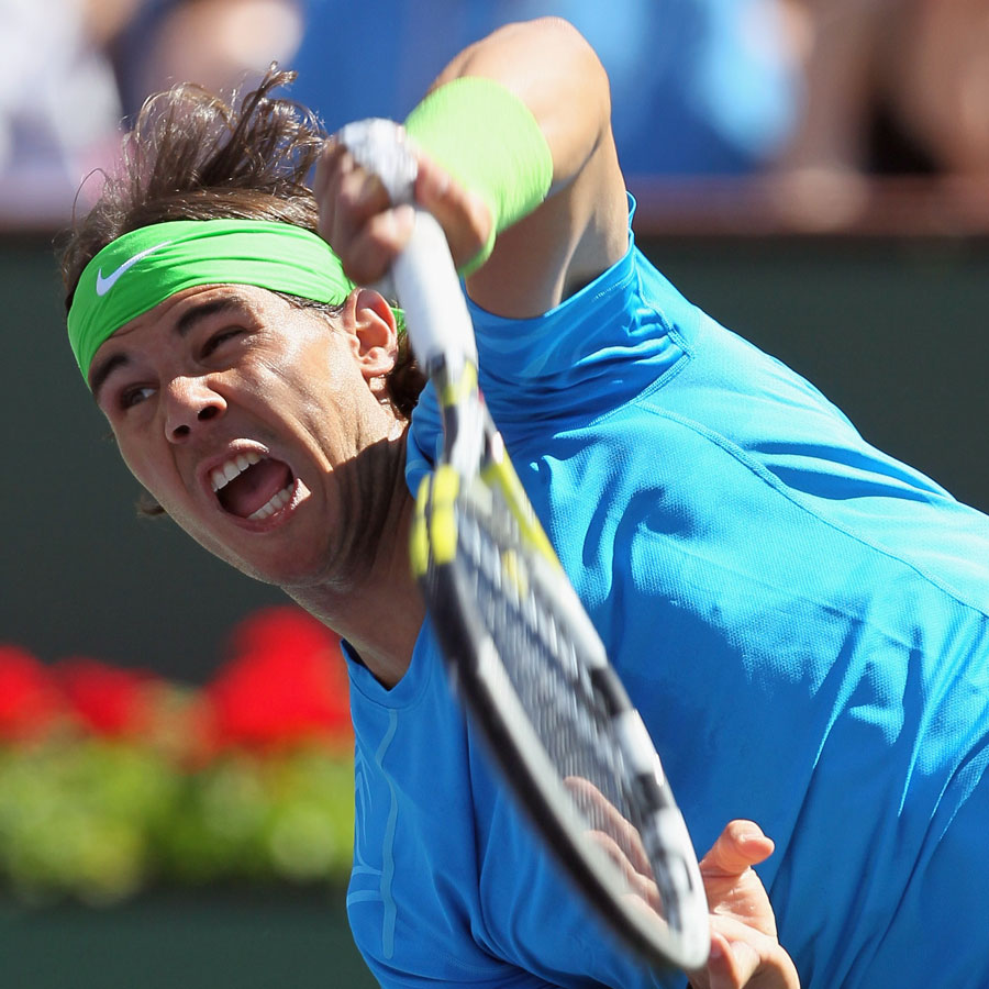Rafael Nadal launches a serve