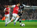 Tomas Rosicky competes with Cheick Tiote