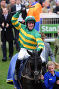 Richie McLernon celebrates the win of Alfie Sherrin in the JLT Speciality Handicap Chase
